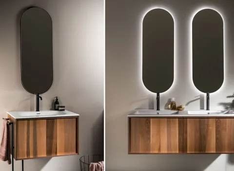 Waschtischlösungen mit Holzfronten und ovalen, beleuchteten Spiegeln von Stocco.