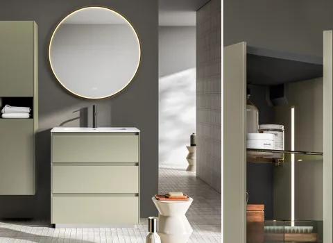 Moderner Waschtisch in salbeigrüner Oberfläche mit rundem LED-Spiegel, schlankem Hochschrank und integrierter Beleuchtung in minimalistischem Badgestaltung von Stocco.