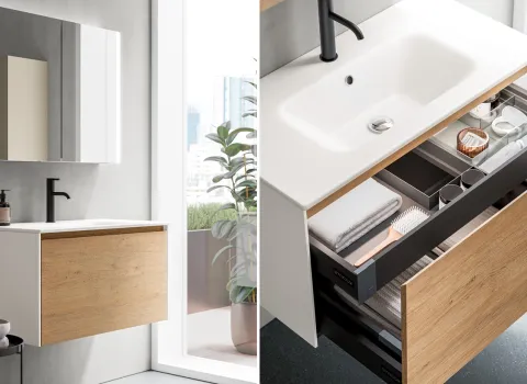 Geöffneter Waschtischunterschrank mit strukturiertem Stauraum und hochwertiger Innenorganisation von Stocco.