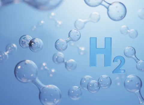 Symolbild zum Thema Wasserstoff. H2 und Moleküle vor blauem Hintergrund. 